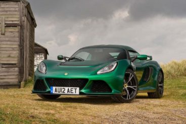 Lotus Exige Roadster in green parked by barn