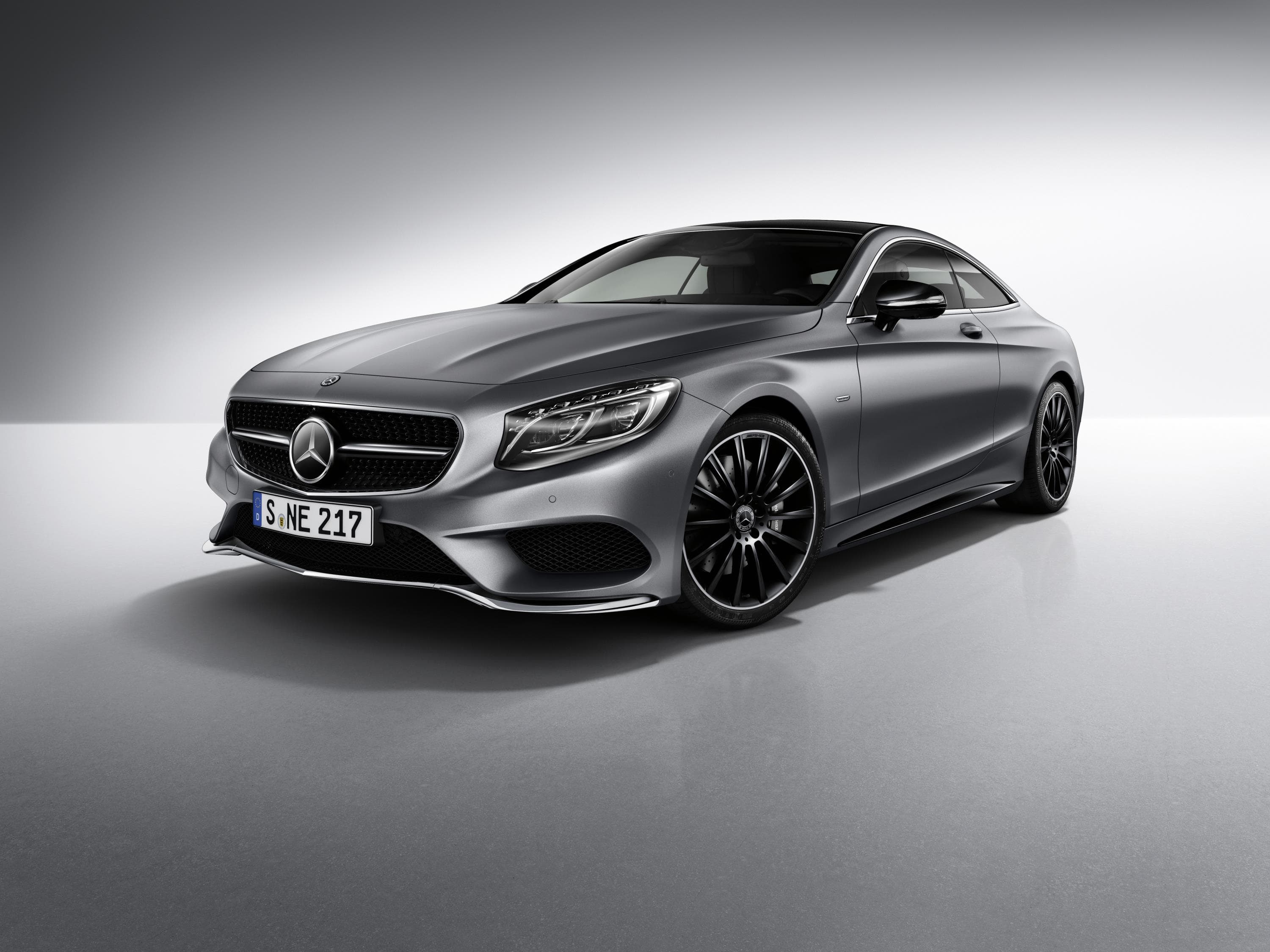dark grey Mercedes s class coupe isolated on silver and white background