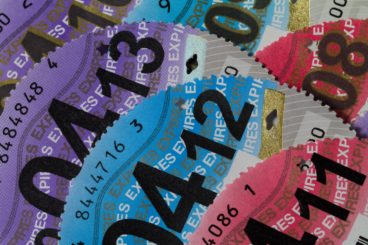 colour pile of out of date tax disks