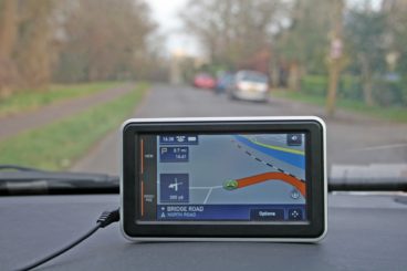 sat nav on top of car dashboard whilst driving