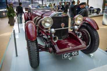 Red Mercedes-Benz SSK at a car exhibition