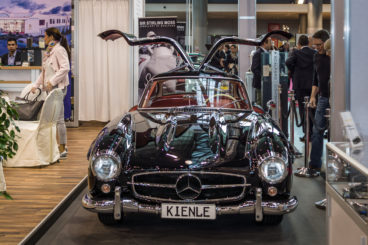 black Mercedes-Benz 300SL Gullwing at an exhibition