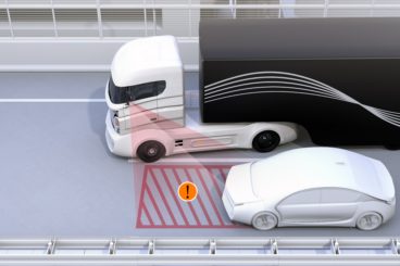 Animation of lorry starting to change lanes and their blind spot safety system warning them of the danger