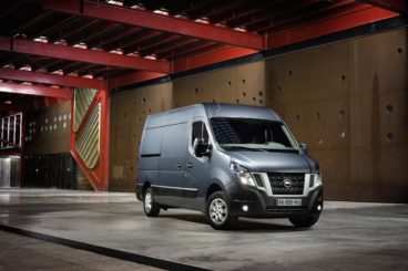 grey nissan NV400 parked in warehouse with red roof bars