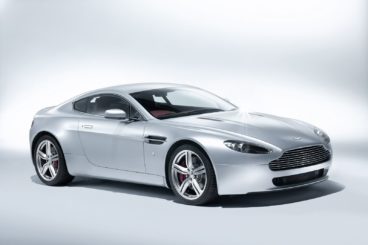 silver aston v8 vantage isolated on a silver/white background