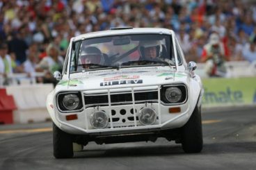 white rally ford escort racing on the track