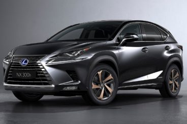 a metallic grey lexus nx estate isolated on a grey background