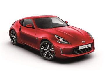 metallic red nissan 370z coupe isolated on a white background