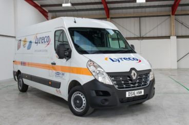 white renault master van with company logos on the side and on the bonnet parked in a large warehouse