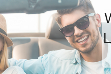Why is Car Leasing So Popular title with couple in a convertible smiling and wearing sunglasses