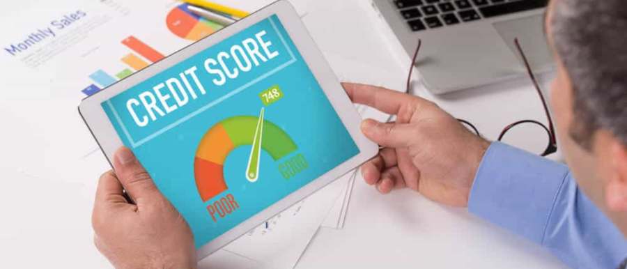 Man checking credit score on tablet