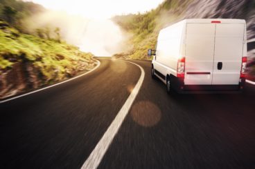 Van driving in to the sunset