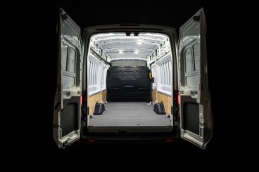 empty van with bright lights on isolated on black background