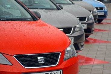 Row of seat cars at a dealership in various colours.