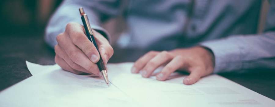 Man signing contract