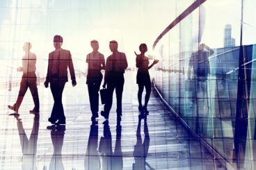 Silhouettes of Business People Walking in the Office