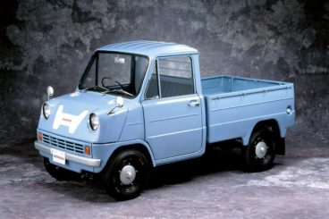 Honda T360 parked on a grey background