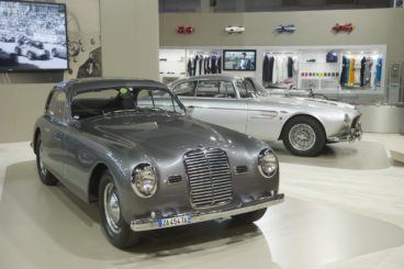Grey Maserati parked in a showroom
