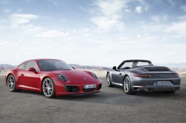 Porsche Carerra in red and black parked on a cliff