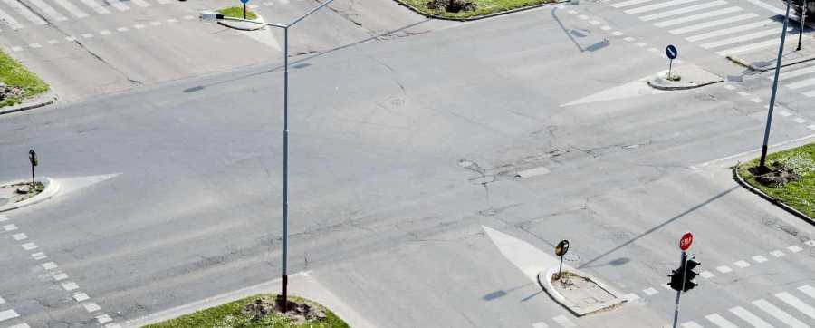 Green cross code - Street crossroad from above. Traffic lights and city traffic