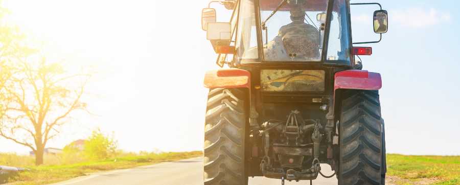 Tractor on road with sunlight