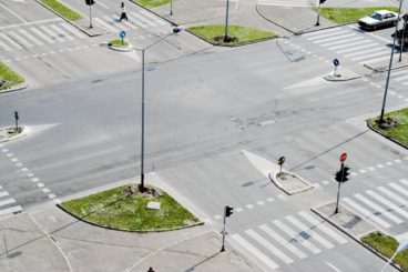 Street crossroad from above. Traffic lights and city traffic