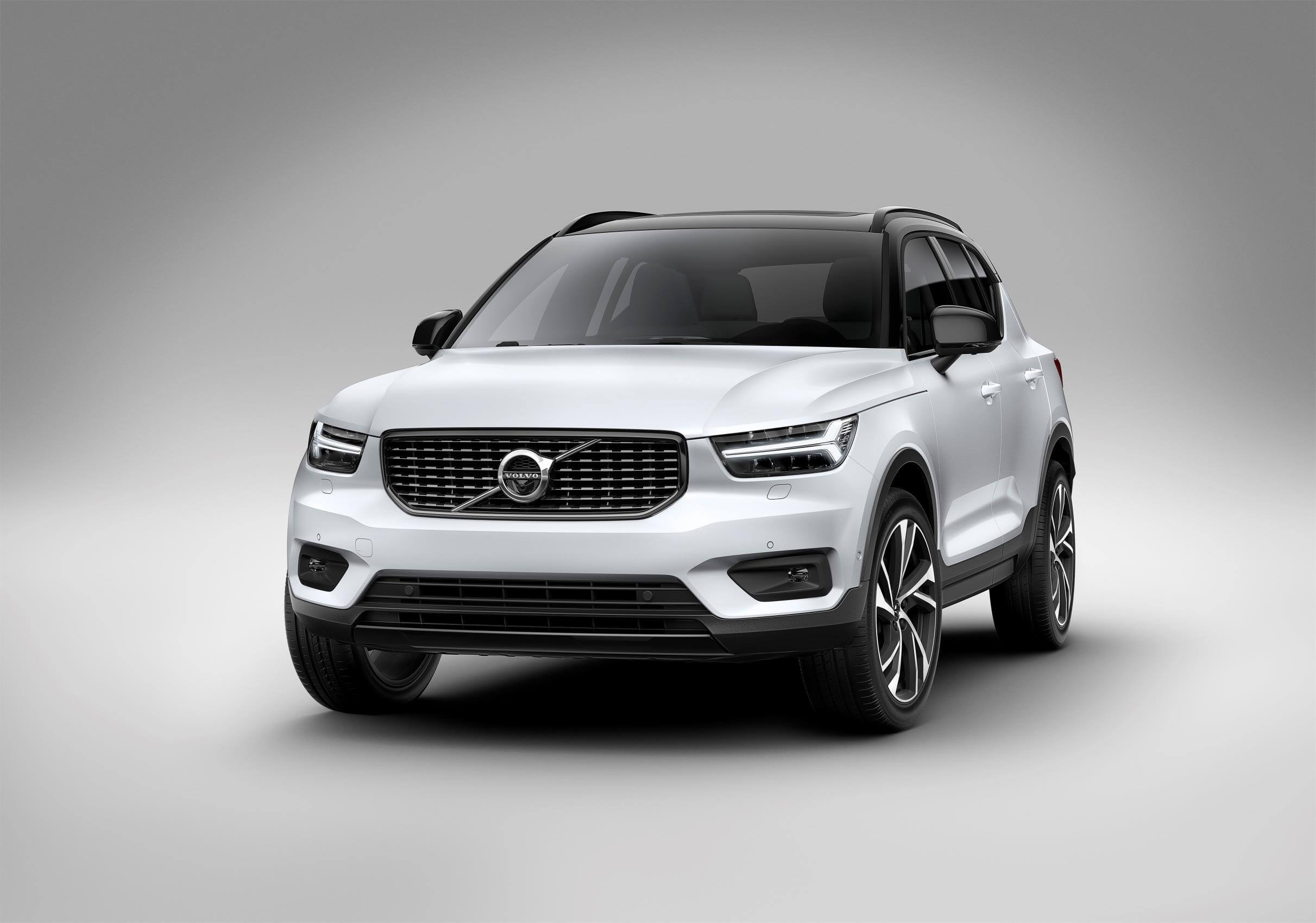 White Volvo XC40 parked on a white background