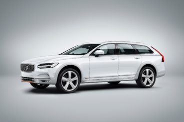 a metallic white volvo V90 Cross Country isolated on grey and white background