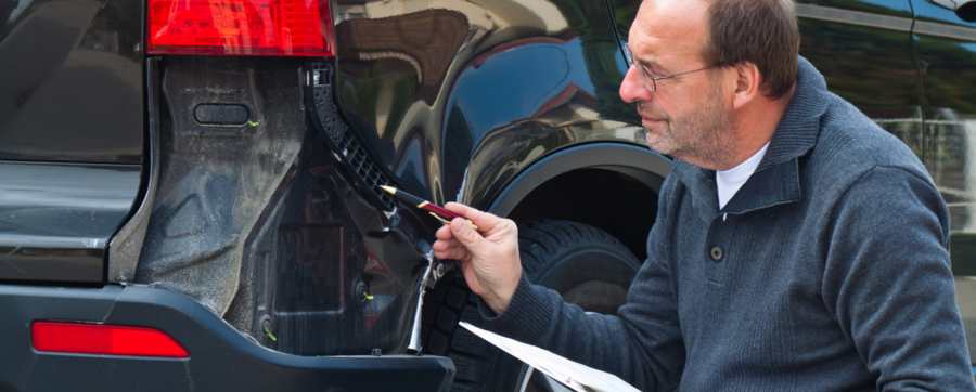 Vehicle being inspected for damage