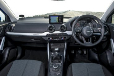 the black leather interior of the audi q2 estate