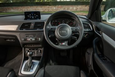 the black leather interior of the audi q3 diesel estate