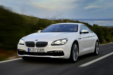 a white bmw 6 series gran diesel coupe