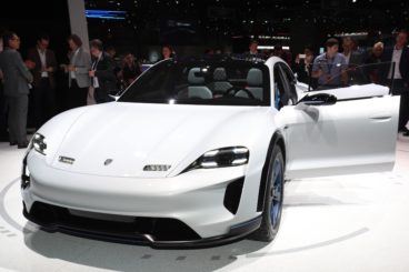 a white porsche mission e at the geneva motor show