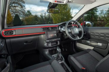the black and red interior of the Citroen C3 diesel hatchback