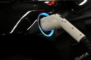 a white electric car charger charging the Ford Focus Electric