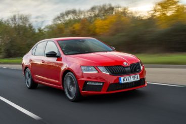 Red Skoda Octavia Driving
