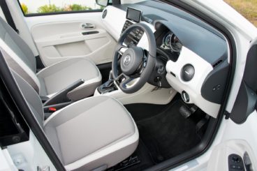 the white and black interior of the volkswagen e-Up!