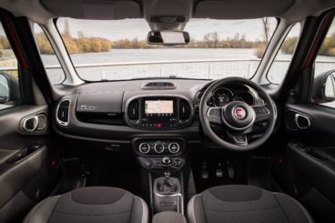 the black cloth & leather interior of the fiat 500l diesel hatchback