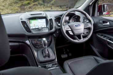 the black leather interior of the ford kuga diesel estate