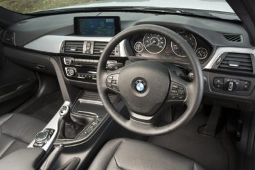 the black leather interior of the bmw 3 series touring