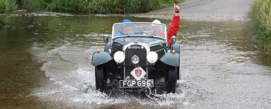 Morgan driving on water-logged British roads