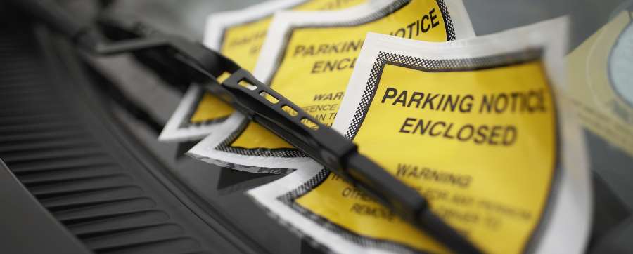 Registered keeper - Car with a series of parking tickets under the windscreen wiper