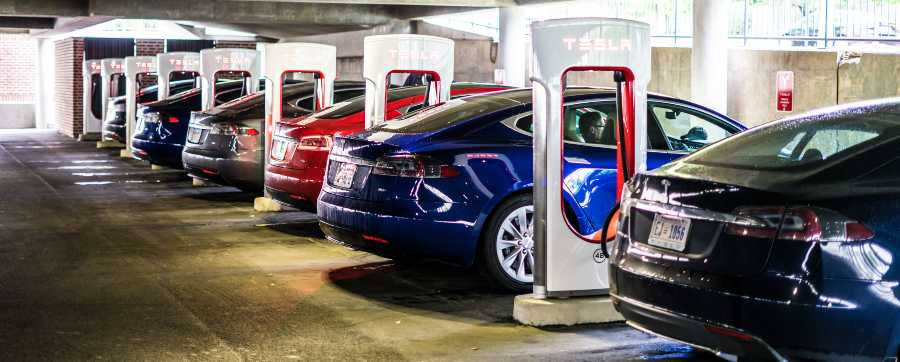 All electric cars charging in a car park