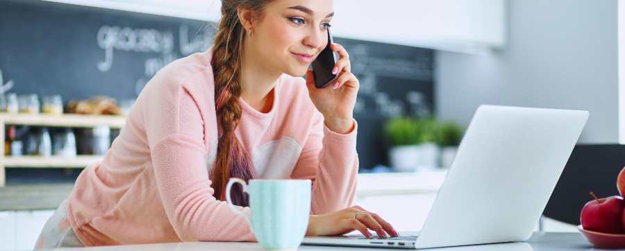 Car dealerships - Woman looking at online car dealerships on her computer