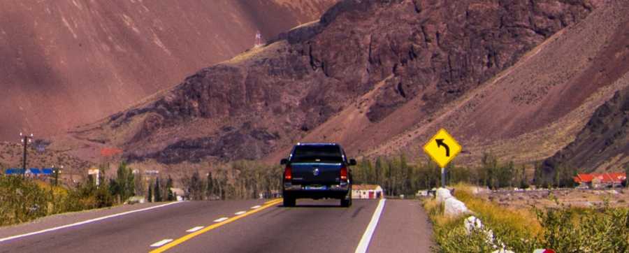 Range anxiety - vehicle driving into the mountains