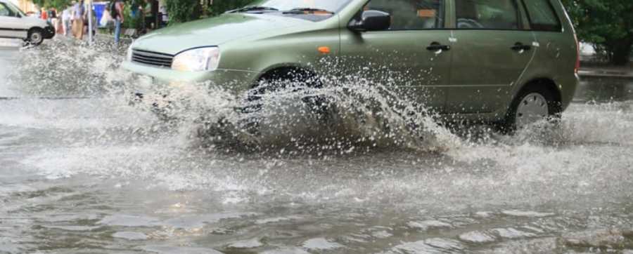 Vehicle driving through a deep puddle