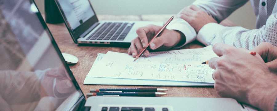 How to lease a vehicle for business - people looking over paperwork
