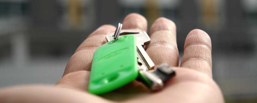 How to lease a vehicle for business - person with keys to new property