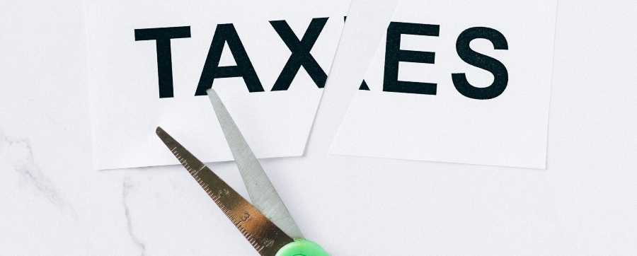 self-employed car finance - image of taxes being cut in two
