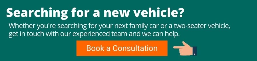 White text on a green background which reads Searching for a new vehicle? Whether you're searching for your next family car or a two-seater vehicle, get in touch with our experienced team and we can help. Underneath is an orange button with white text that reads Book a consultation. This has a finger pointing towards it from the right to left